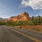 scenic roadway running through red rock formations in Sedona, Arizona