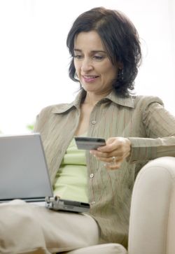 Woman using her credit card online
