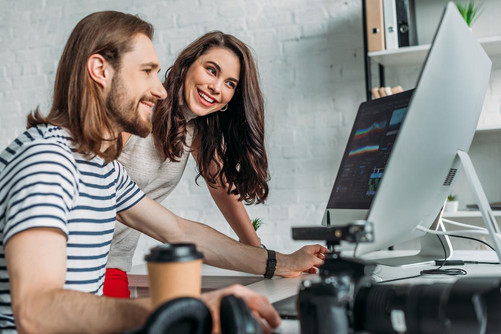 Work with NEXTFLY to deploy content marketing for business growth image shows employees looking at monitor
